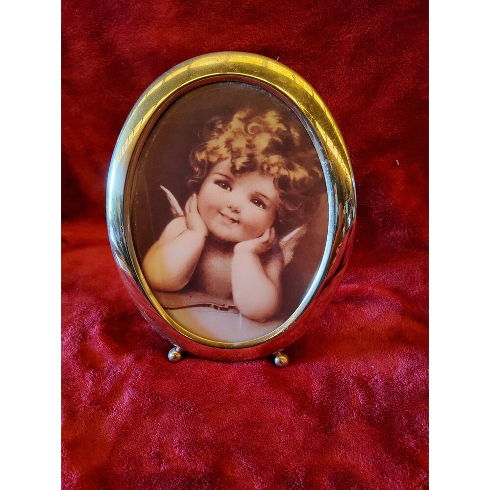 Photo by Bessi Pease Gutmann in Oval Frame Tender Reflections